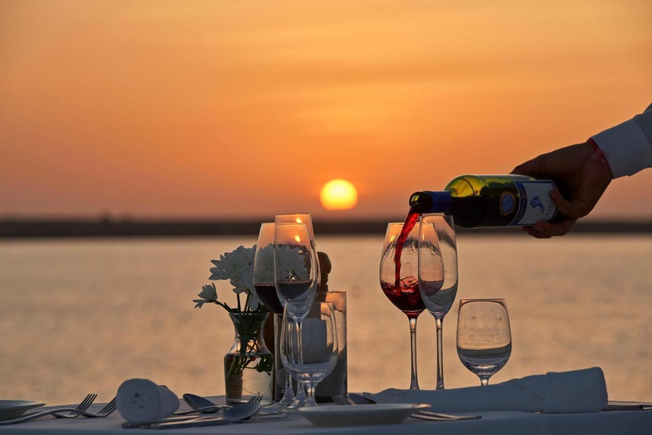 Fanar Hotel & Residences Салала Экстерьер фото Sunset dinner at the beach