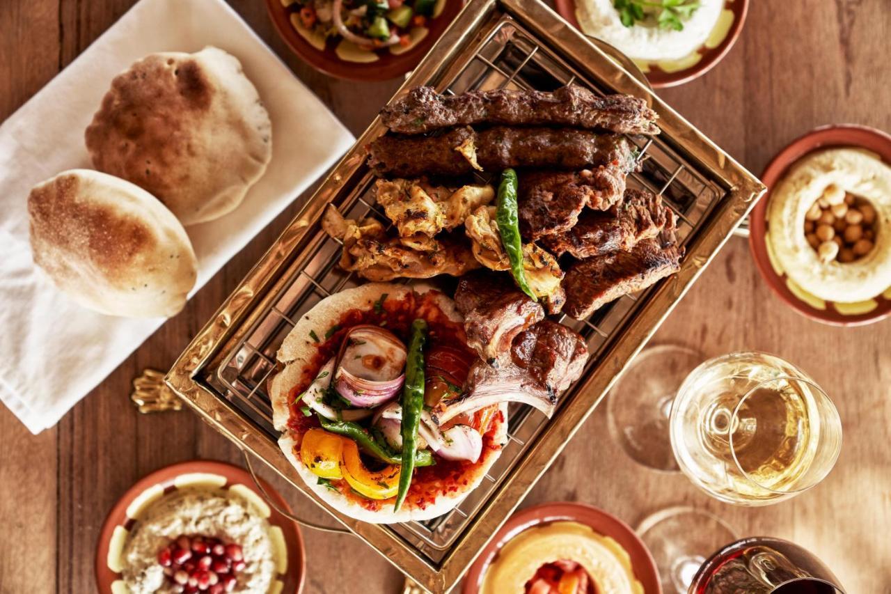 Fanar Hotel & Residences Салала Экстерьер фото A selection of Middle Eastern cuisine